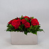 Arrangement with red preserved roses